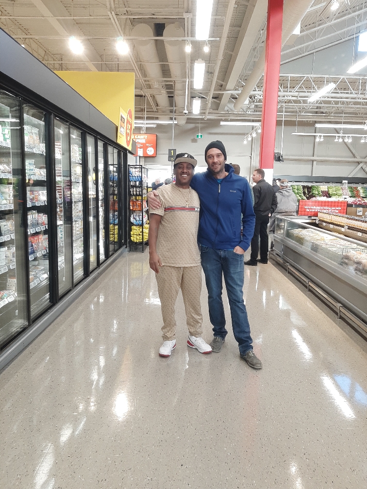 Ameche Cleaning Service representative with retail partner